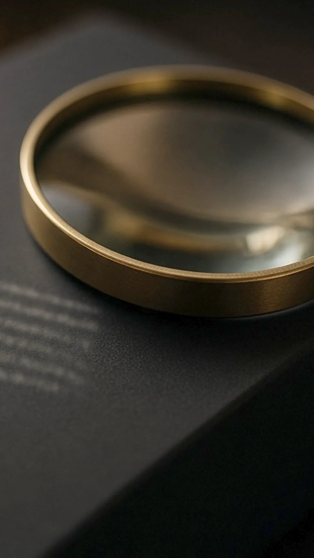 Magnifying glass over a plain box with blurred printed text